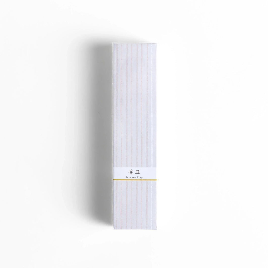 Minimalist white ceramic Japanese incense holder with rectangular shape and slot for clean ash catching.