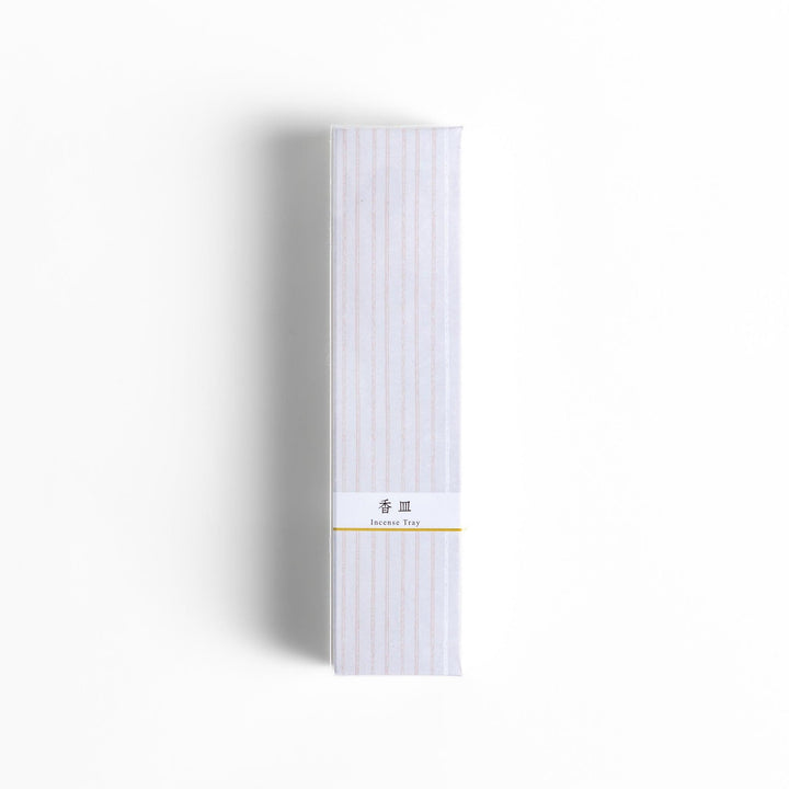 Minimalist white ceramic Japanese incense holder with rectangular shape and slot for clean ash catching.