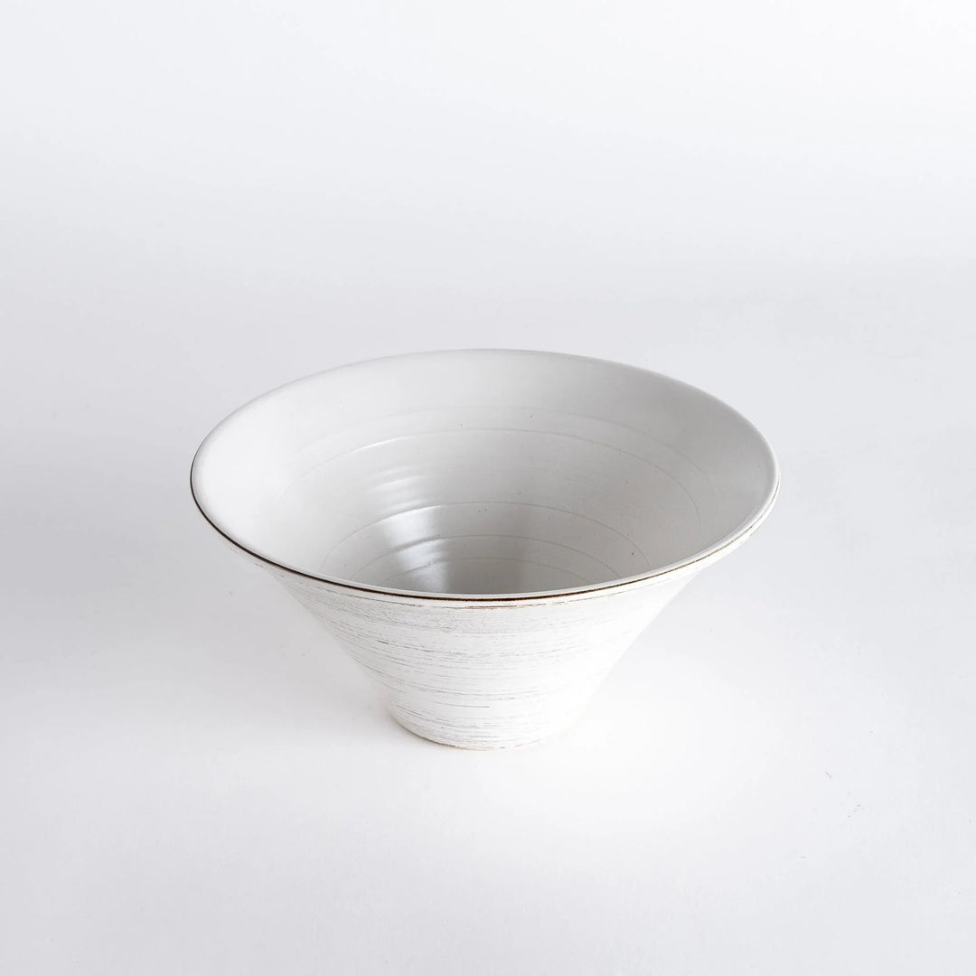 Top-down view of the white bowl, featuring the intricate spiral texture along the rim and a clear base.