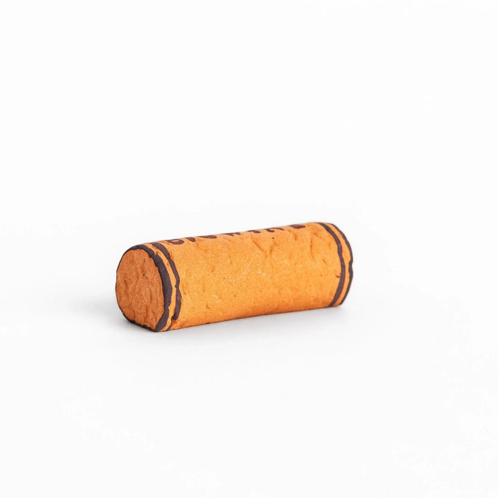 Fun chopstick rest shaped like a wine cork, featuring the word "BIOWINE" printed in bold on the side for a playful touch.
