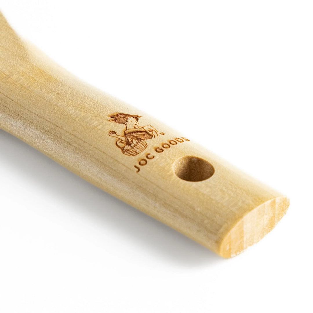 Wood handle julienne peeler with sharp stainless steel blade and JOC Goods logo for vegetable strips.