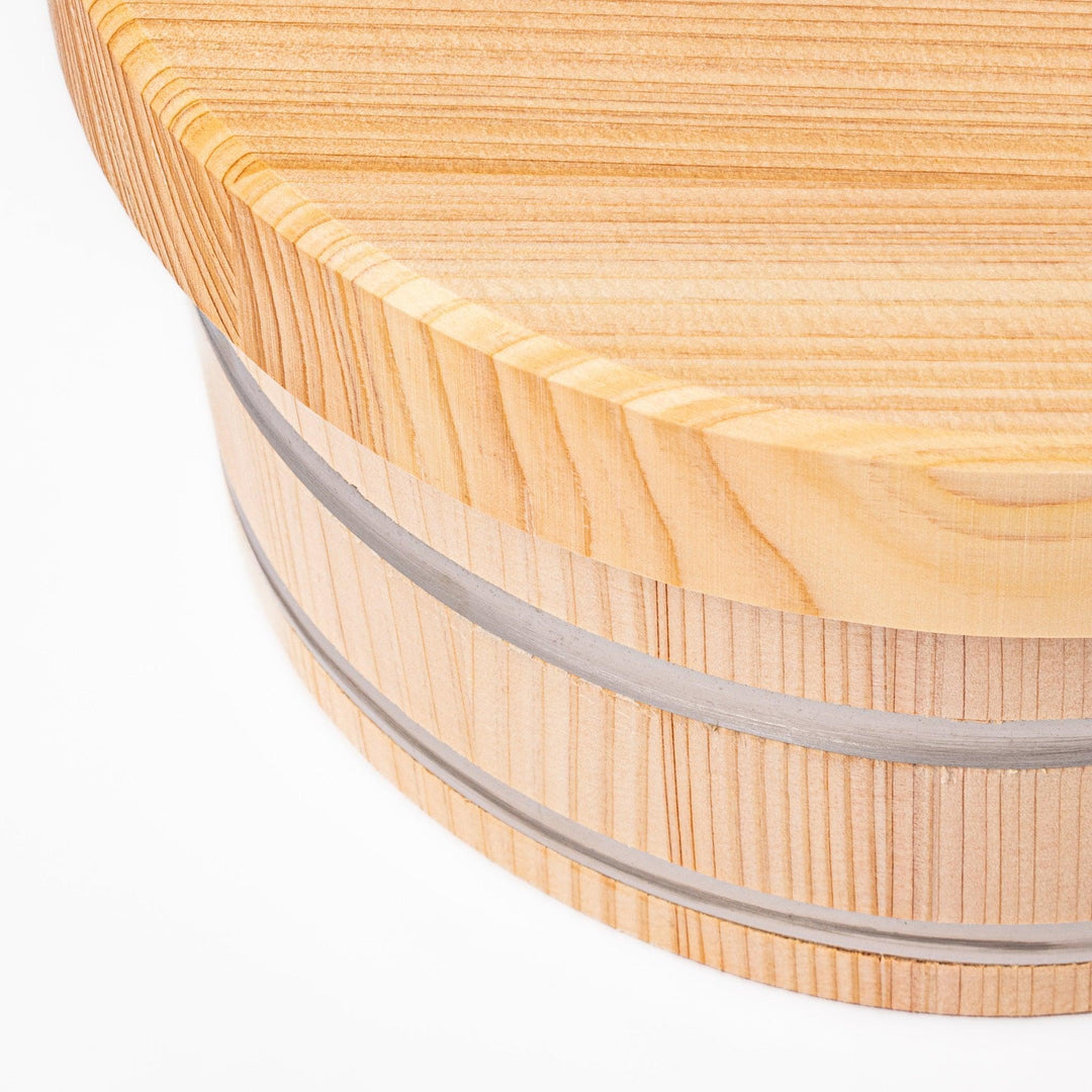 Wooden rice container with lid, ideal for storing and serving freshly cooked Japanese rice.