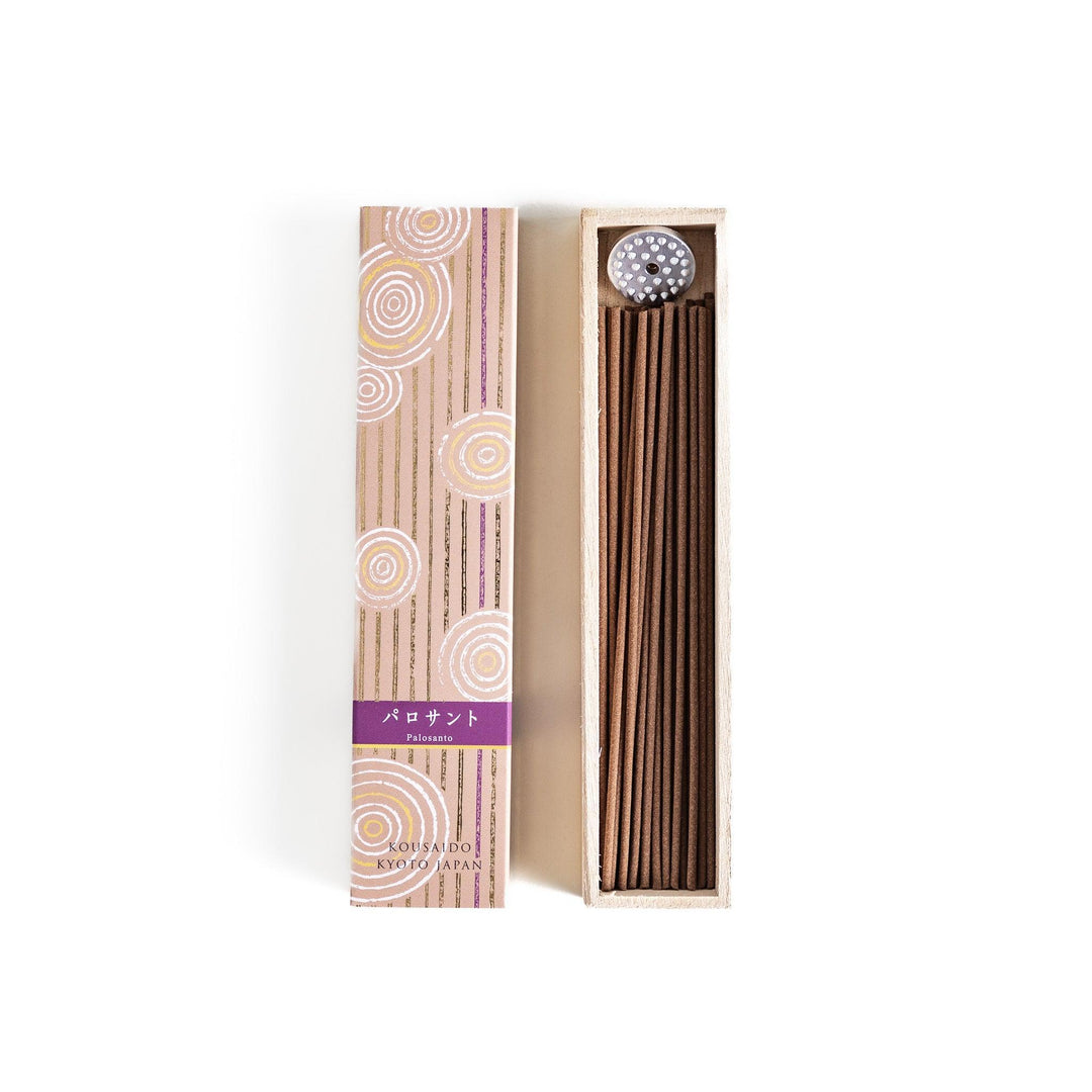 Japanese Palo Santo incense sticks neatly arranged in a wooden box with a decorative paper sleeve from Kyoto’s Kousaido