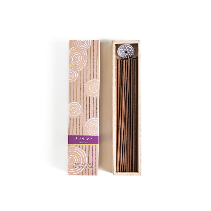 Japanese Palo Santo incense sticks neatly arranged in a wooden box with a decorative paper sleeve from Kyoto’s Kousaido