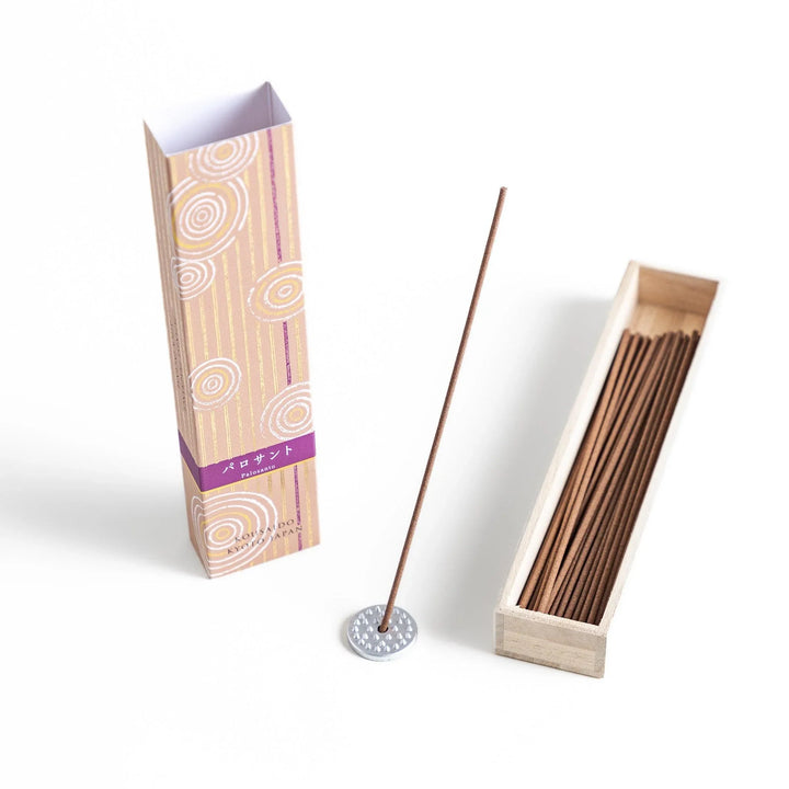 Japanese Palo Santo incense sticks neatly arranged in a wooden box with a decorative paper sleeve from Kyoto’s Kousaido