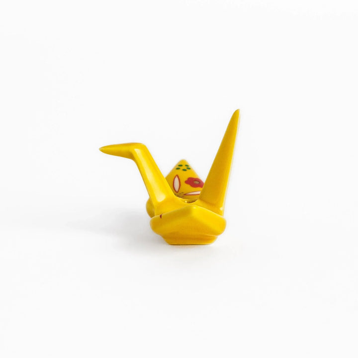 Yellow origami crane incense holder with floral motifs perfect for bringing charm and serenity to any space.