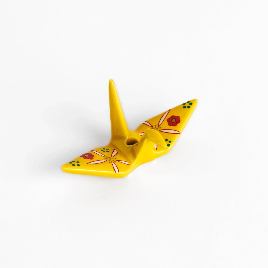 Yellow origami crane incense holder with floral motifs perfect for bringing charm and serenity to any space.
