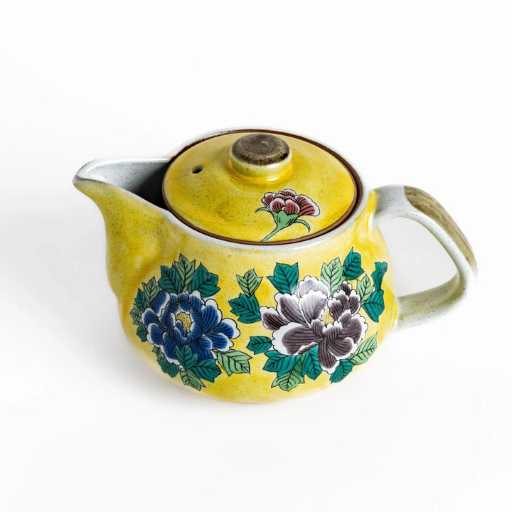 Vibrant yellow teapot adorned with colorful peony flowers, perfect for adding a touch of elegance and charm to your tea time.