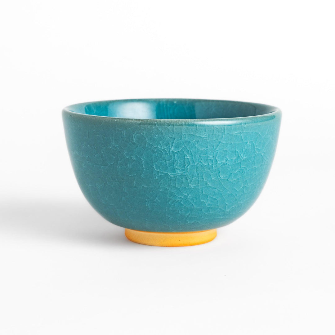 Stunning turquoise Matcha bowl with a unique crackle glaze, perfect for enjoying a traditional Japanese tea ceremony.