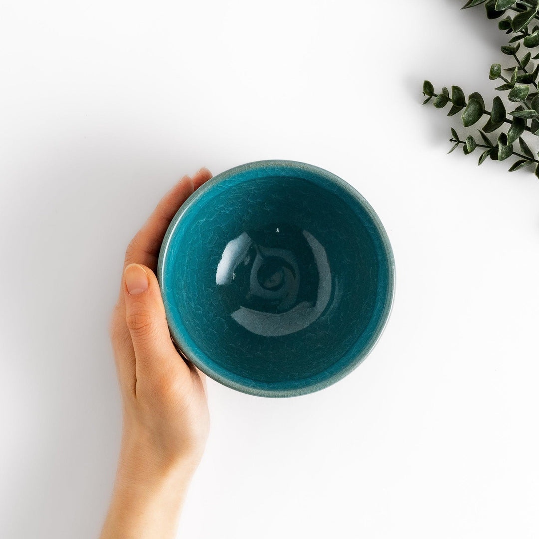 Stunning turquoise Matcha bowl with a unique crackle glaze, perfect for enjoying a traditional Japanese tea ceremony.