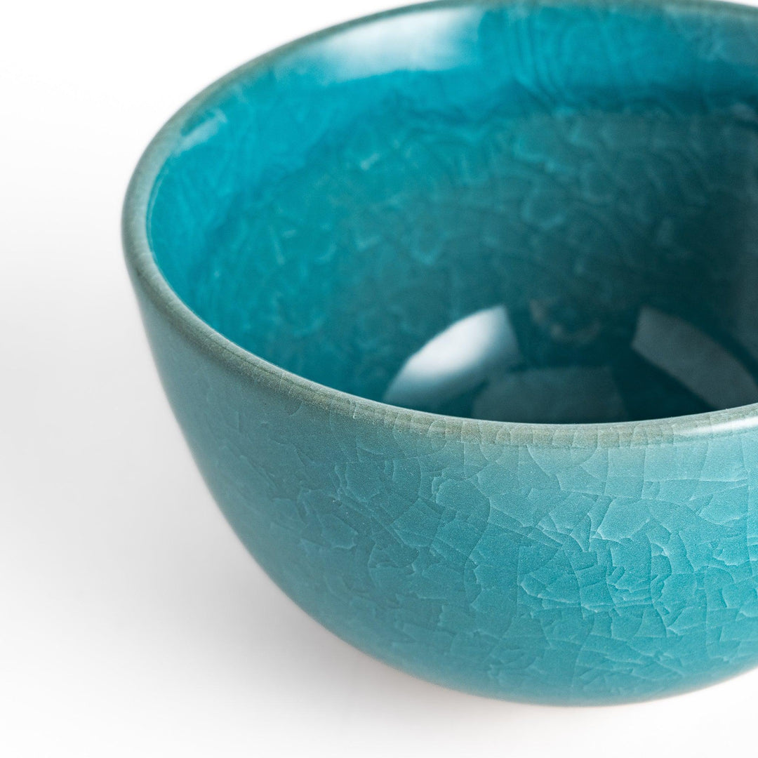 Stunning turquoise Matcha bowl with a unique crackle glaze, perfect for enjoying a traditional Japanese tea ceremony.