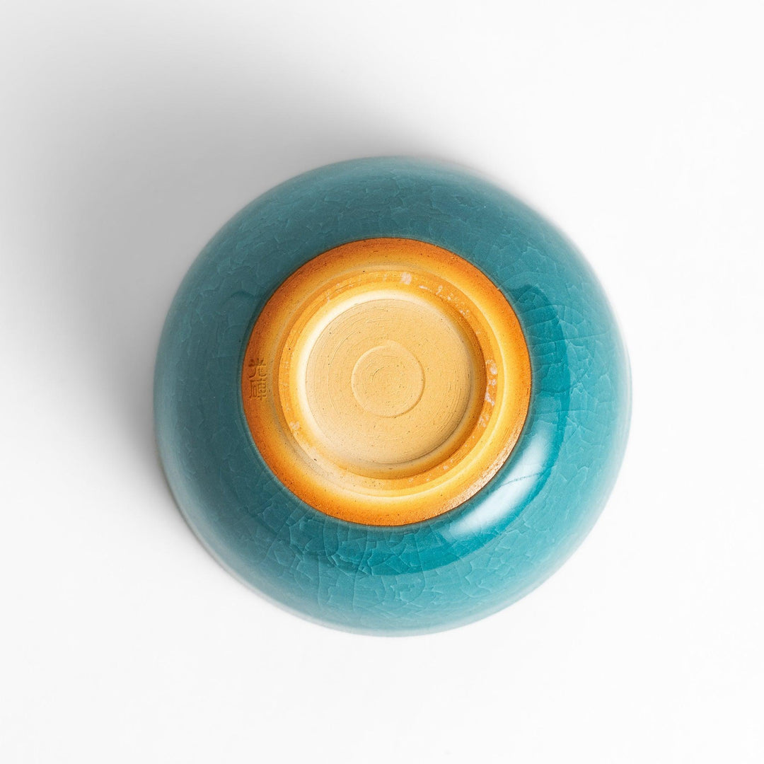 Stunning turquoise Matcha bowl with a unique crackle glaze, perfect for enjoying a traditional Japanese tea ceremony.