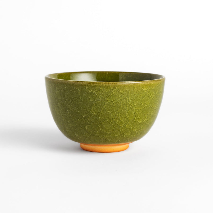 Artistic ceramic Matcha Bowl featuring a rich green glaze and a contrasting base.